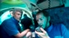 FILE - Submersible pilot Randy Holt, right, and Stockton Rush, left, CEO and Co-Founder of OceanGate, dive in the company's submersible, "Antipodes," about three miles off the coast of Fort Lauderdale, Fla., June 28, 2013.