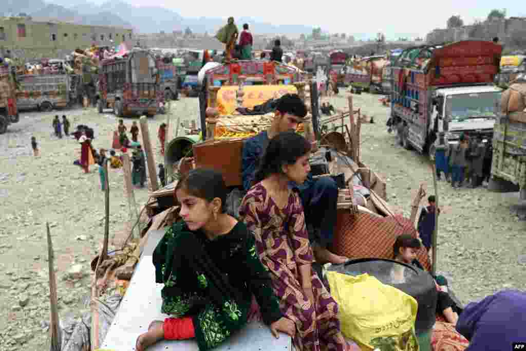 Afghan refugees arrive with their belongings on trucks from Pakistan at the Afghanistan-Pakistan Torkham border in Nangarhar province. Hundreds of thousands of Afghans living in Pakistan faced the threat of detention and deportation on November 1, as a government deadline for them to leave sparked a mass exodus.