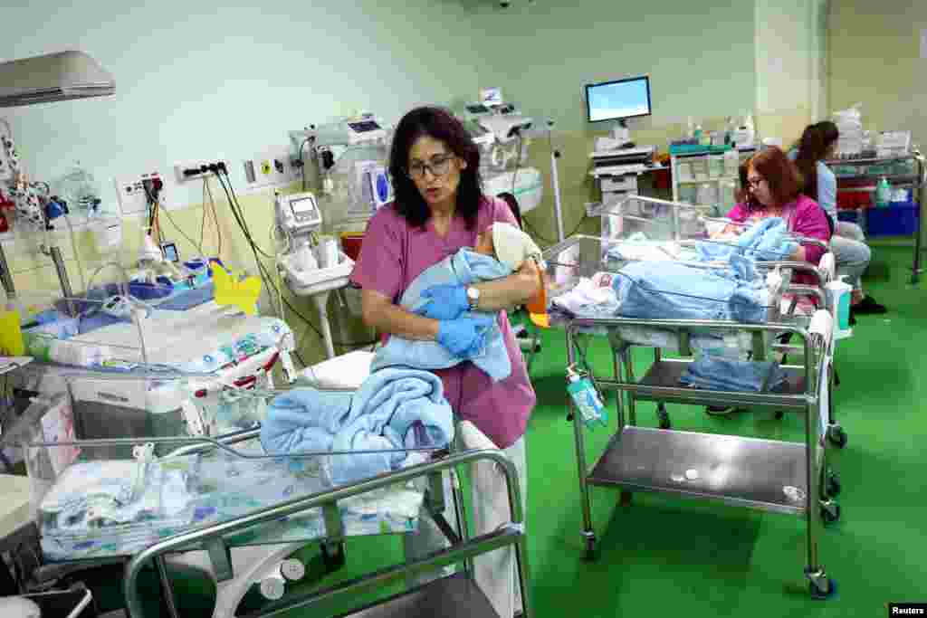 Medical staff attend the newborns at an underground medical bunker at the Galilee Medical Center near Israel's border with Lebanon in northern Israel.