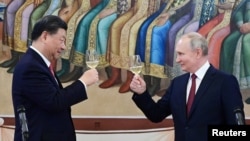 資料照片：俄羅斯總統普京和中國國家主席習近平在莫斯科克里姆林宮共同出席招待會。（2023年3月21日）