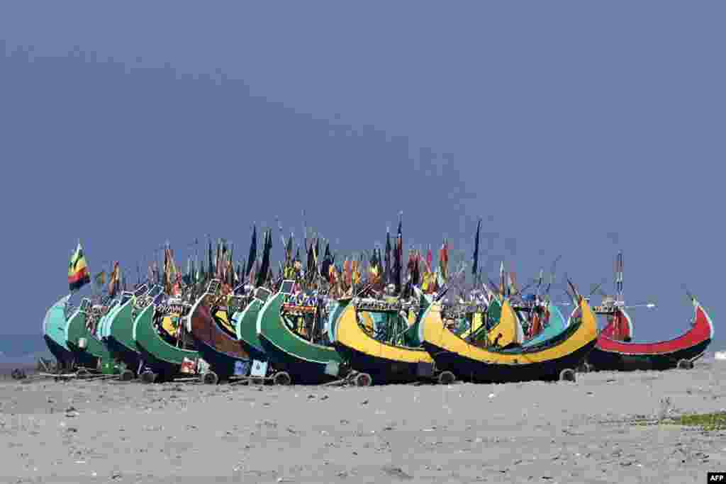 Fishing boats are seen along a beach in Teknaf, Bangladesh.
