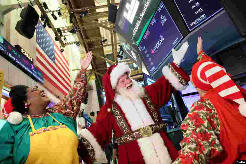 Macy's Santa Claus, appears on the trading floor to celebrate the 97th Macy’s Thanksgiving Day Parade at the New York Stock Exchange (NYSE) in New York City.