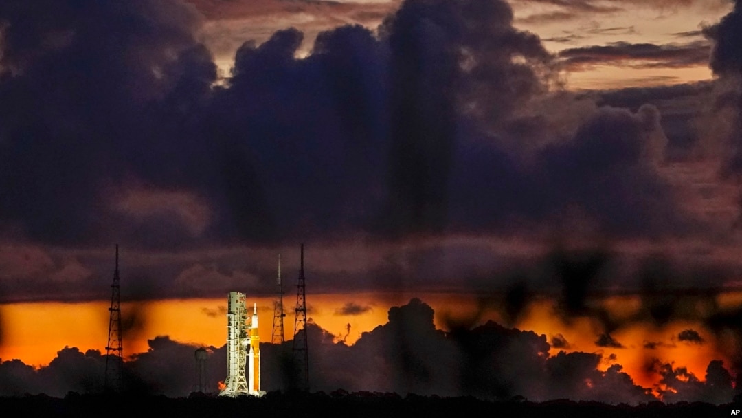 The NASA moon rocket stands ready at sunrise on Pad 39B before the Artemis 1 mission to orbit the moon at the Kennedy Space Center, Monday, Aug. 29, 2022, in Cape Canaveral, Fla. (AP Photo/Brynn Anderson)