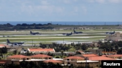 FILE - U.S. military planes are parked on the tarmac of Andersen Air Force base on the island of Guam, Aug. 15, 2017. Critical infrastructure organizations in Guam and the United States have been targeted by a China-based hacker, Microsoft said May 24, 2023.