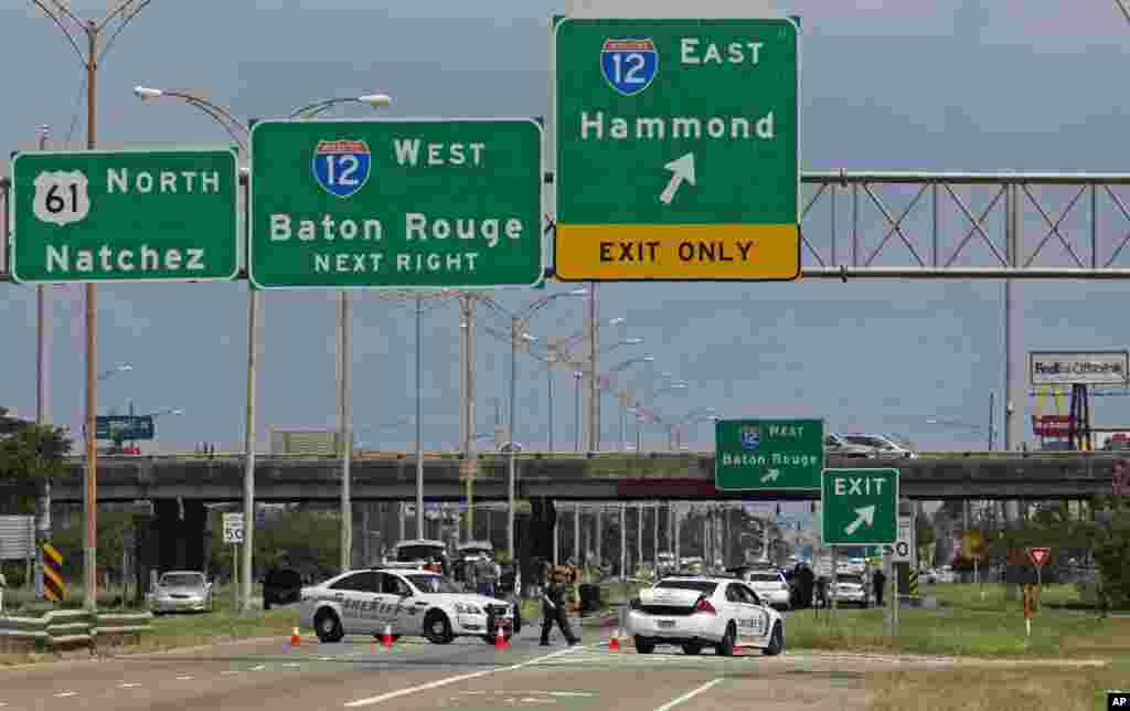 Baton Rouge police block Airline Highway after police were shot in Baton Rouge, Louisiana. Authorities say three law enforcement officers were dead, and several injured.