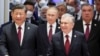 FILE - Presidents Xi Jinping of China, left, Vladimir Putin of Russia, center, Uzbekistan's Shavkat Mirziyoyev, second right, and Emomali Rahmon, at the Shanghai Cooperation Organization summit in Uzbekistan, Sept. 16, 2022. 