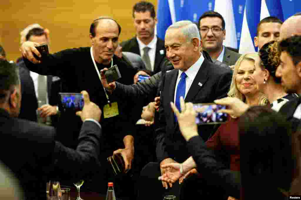 Israeli Prime Minister Benjamin Netanyahu attends a toast for the new Speaker of the Knesset Amir Ohana (unseen) after the new government is sworn in at the parliament, in Jerusalem. 