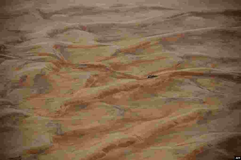 Toyota's Argentinian driver Juan Cruz Yacopini and Spainish co-driver Daniel Oliveras Carreras compete during Stage 8 of the Dakar 2023 between Al Duwadimi and Riyadh, Saudi Arabia.