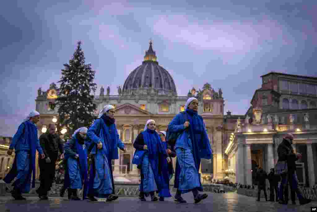 Nuns arrive at dawn to view the body of Pope Emeritus Benedict XVI as it lies in state in St. Peter's Basilica at the Vatican. The Vatican announced that his funeral will be held on Jan. 5, 2023.