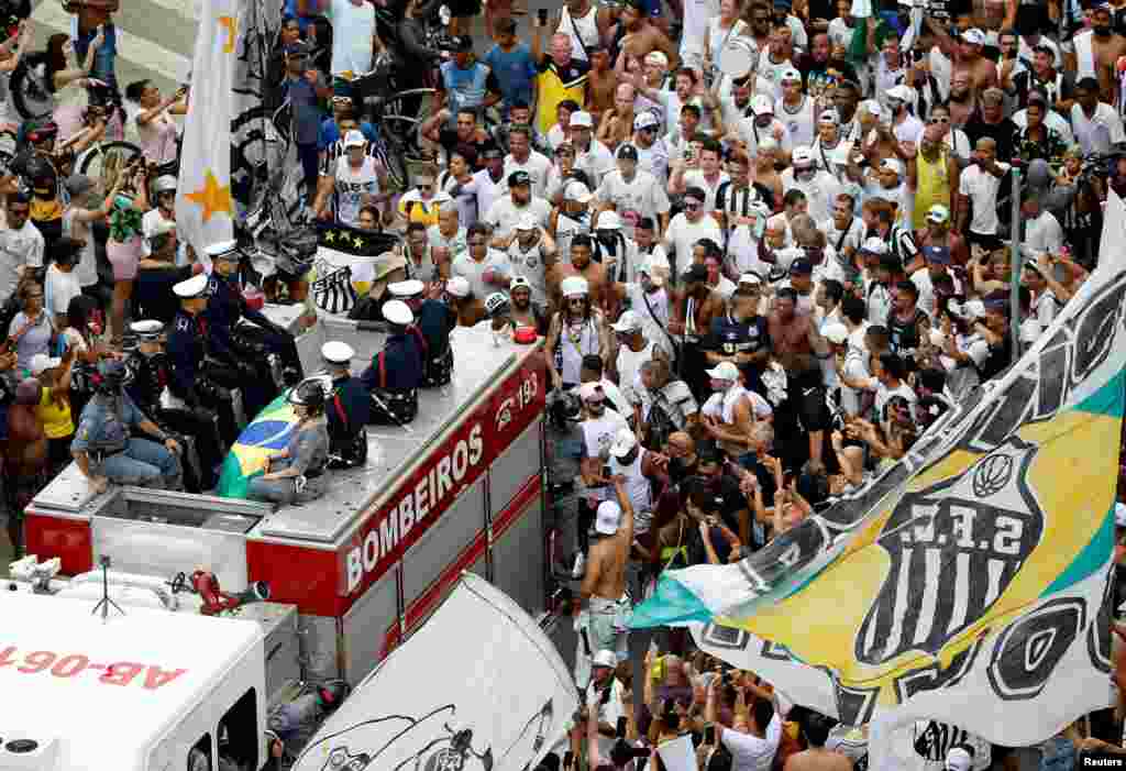 The casket of Brazilian soccer legend Pele is transported to the Santos' Memorial Cemetery during his funeral procession in Santos.