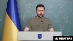 Ukrainian President Volodymr Zelenskiy speaks during his nightly address in Kviv, saying that the "battle of Donbas" has begun on April 18, 2022. Ukrainian Presidential Press Service via Reuters)