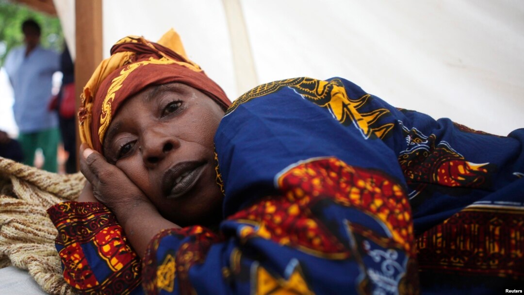 FILE - A cholera patient lies in a treatment centre run by Medecins Sans Frontieres on Macauley Street in Sierra Leone's capital Freetown, Aug. 2012. 