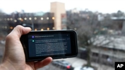 A ChatGPT prompt is shown on a device near a public school in Brooklyn, New York, Thursday, Jan. 5, 2023. (AP Photo/Peter Morgan)