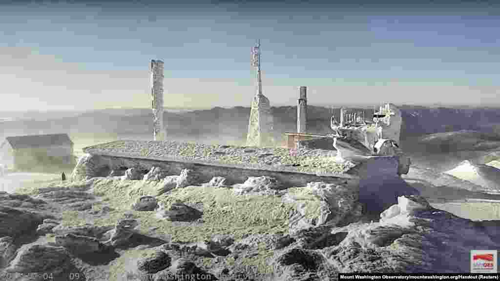 A view from the top of the observatory tower at Mount Washington State Park, where the wind chill dropped to -105° F (-79° C) is seen in a still image from a live camera in New Hampshire, Feb. 4, 2023.