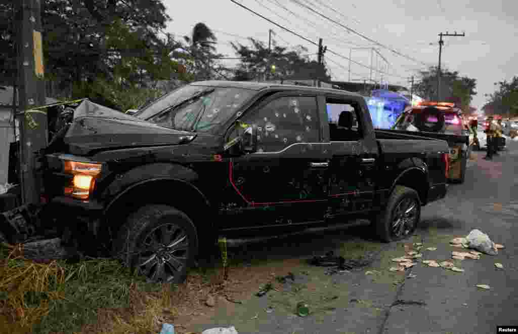 A view shows a vehicle riddled with bullet holes on a road where according to local media at least six people, including two minors, died during an armed attack, in Veracruz, Mexico, Jan. 22, 2023.