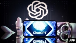 FILE - An illustration photo taken Jan. 23, 2023, shows screens displaying the logos of OpenAI and ChatGPT.