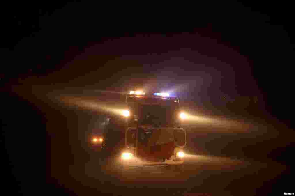 A firefighter truck responds to a wildfire in Quillon, Chile, Feb. 7, 2023.