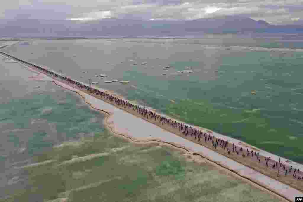 Competitors running on salty soil during the Dead Sea Marathon, in the Israeli resort of Ein Bokek.