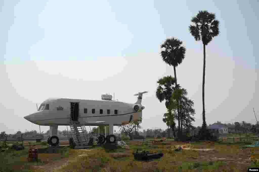 The "airplane house" built by Chrach Pov is seen in Siem Reap province, Cambodia. Chrach Pov, 43, inspired by a lifelong dream of flying, has built a home that is modelled on a plane, complete with a fuselage-like structure standing 6 meters (19.69 ft) above the ground housing his two bedrooms and bathrooms.