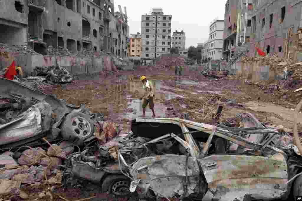 A man walks at the site where a garment factory building collapsed on April 24 in Savar, near Dhaka, Bangladesh, May 13, 2013.