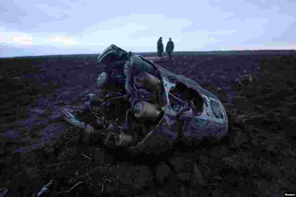 Investigators gather near fragments of a munition in the Grodno region, Belarus. (Vadzim Yakubionak/BelTA/Handout via Reuters)