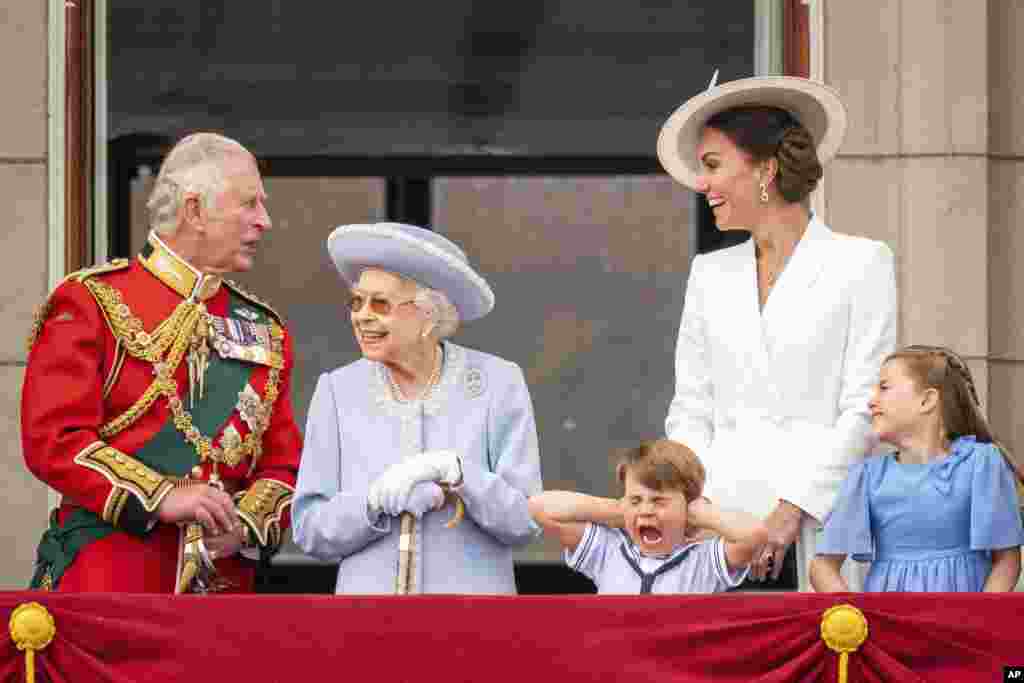 Britain's Prince Charles, Queen Elizabeth II, Prince Louis, Kate, Duchess of Cambridge and Princess Charlotte stands on the balcony of Buckingham Palace after the Trooping the Color ceremony in London, June 2, 2022, on the first of four days of celebrations to mark the Platinum Jubilee.