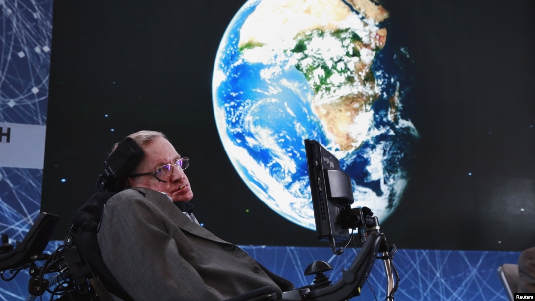 FILE - Physicist Stephen Hawking sits on stage during an announcement of the Starshot initiative with investor Yuri Milner in New York, April 12, 2016. A partnership was announced this week with the European Southern Observatory, which will use one of their telescopes to hunt for inhabitable planets. 