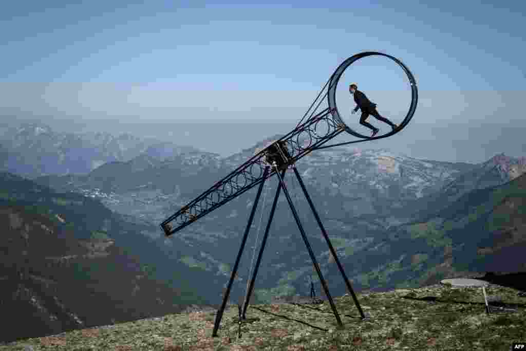Swiss acrobat Ramon Kathriner performs with the "Wheel of The Death" during the Glacier 3000 Air show an event marking the reopening of the Alpine facilities above Les Diablerets following the lockdown due to the COVID-19 outbreak.