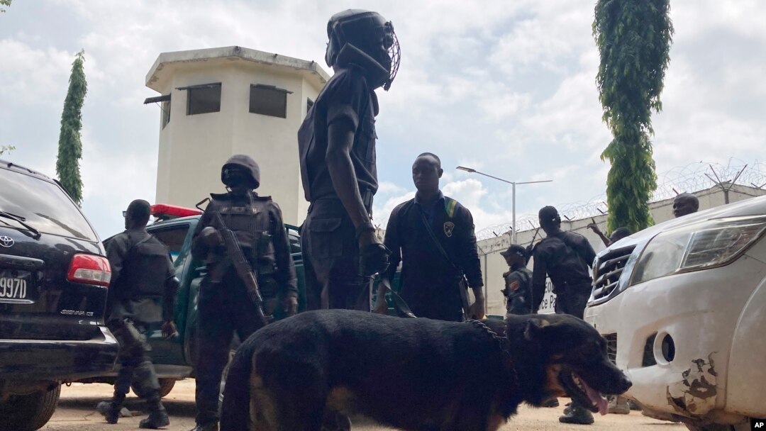 Officers stand guard outside the Kuje maximum prison following a rebel attack in Kuje, Nigeria, July 6, 2022. 
