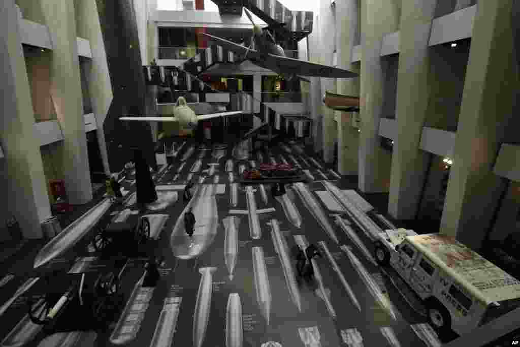 Art installation by Chinese artist Ai Weiwei entitled "History of Bombs" is seen covering the floor and a staircase in the Atrium at the Imperial War Museum in London.