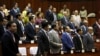 Members of parliament attend a plenary session at the Cambodia National Assembly in Central Phnom Penh, December 16, 2015. 