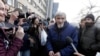 FILE - Russian historian Yuri Dmitriyev, center, speaks to the media outside a court in the city of Petrozavodsk, northwestern Russia, April 5, 2018.
