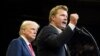 FILE - Republican presidential nominee and former U.S. President Donald Trump listens as Montana Senate candidate Tim Sheehy speaks at a campaign rally in Bozeman, Montana, on Aug. 9, 2024.