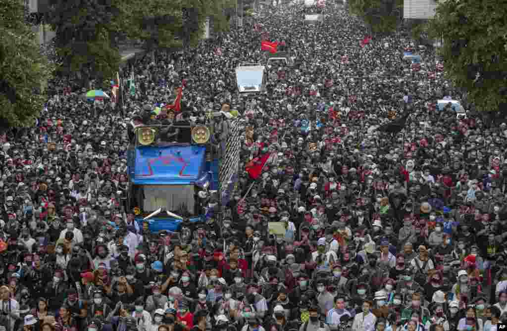 Pro-democracy protesters march in Bangkok, Thailand. Thousands of anti-government protesters gathered for a rally being held on the anniversary of a 1973 popular uprising that led to the ousting of a military dictatorship.