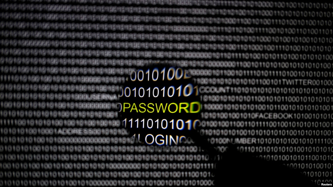 FILE - A magnifying glass is held in front of a computer screen in this picture illustration taken in Berlin, undated.