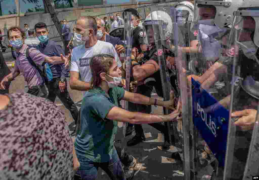 Demonstrators clash with Turkish riot police during a "March for Democracy" called by Republican People's Party (HDP), after three opposition MPs were revoked and sent to prison at Silivri, in Istanbul, Turkey.