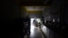 Laundromat owner Jesus Vazquez pauses before closing his San Juan, Puerto Rico, shop to comply with the government's coronavirus curfew on March 20.