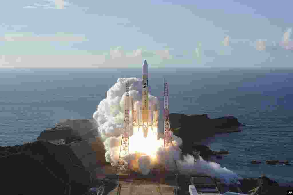 In this photo released by MHI, an H-IIA rocket with United Arab Emirates' Mars orbiter Hope lifts off from Tanegashima Space Center in Kagoshima, southern Japan. A United Arab Emirates spacecraft rocketed away on a seven-month journey to Mars, kicking off the Arab world’s first interplanetary mission. 