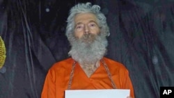 FILE - Undated handout photo shows retired FBI agent Robert Levinson. His family received these photographs in April 2011. 