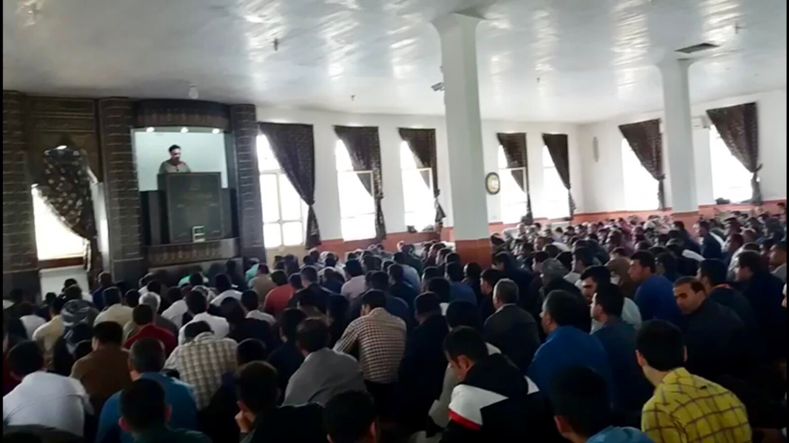Hundreds of Iranian Kurds attend a Friday prayer service, May 4, 2018, led by imam Mohammad Adibi, a supporter of a 20-day-old protest movement.
