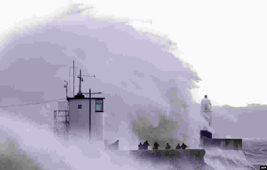Waves crash against the sea wall at Porthcawl, south Wales, as Storm Ellen brings high winds across the country.