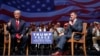 FILE - Then-Republican presidential candidate Donald Trump gives a thumbs up as he appears with retired Lt. Gen. Michael Flynn during a town hall in Virginia Beach, Virginia, Sept. 6, 2016.