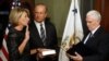 Vice President Mike Pence swears in Betsy DeVos as U.S. education secretary at the Eisenhower Executive Office Building at the White House in Washington, Feb. 7, 2017. With them is DeVos' husband, Dick DeVos.