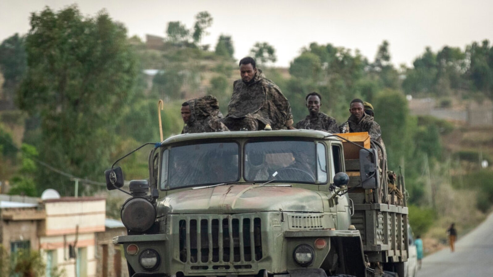 FILE - Government soldiers ride in the back of a truck, in Ethiopia, May 11, 2021.