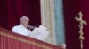 Pope Francis reads is message before delivering the Urbi et Orbi (Latin for 'to the city and to the world' ) Christmas' day blessing from the main balcony of St. Peter's Basilica at the Vatican, Dec. 25, 2019.