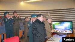 North Korean leader Kim Jong Un reacts as he watches a long range rocket launch in this undated photo released by North Korea's Korean Central News Agency (KCNA) in Pyongyang, Feb. 7, 2016.