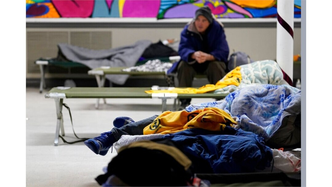 People seeking shelter from sup-freezing temperatures rest at a makeshift warming shelter at Travis Park Methodist Church, in San Antonio, Feb. 16, 2021.