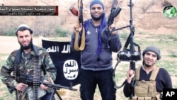 Undated image posted on militant website purports to show evidence of growing cross-border alliance between two powerful Sunni jihadi groups: Al-Qaida in Iraq and the Nusra Front in Syria.