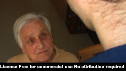 Helping An Elderly Lady to Dress