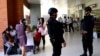 FILE - Indonesian Special Police patrol at Ngurah Rai Airport in Denpasar on Indonesia's resort island of Bali on Jan. 15, 2016.
